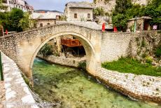 Old City of Mostar - Old Bridge Area of the Old City of Mostar: The Crooked Bridge (Kriva Cuprija) is a tiny stone arch bridge and looks like a miniature version of...