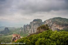 Monasteries of Meteora - The Monasteries of Meteora perched on the rocks. In the 14th century, Greece was ruled by the Ottoman Empire, many monks found a...