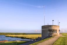 Wadden Sea: Denmark - The tower of the modern Højer Vidåslusen is a striking landmark in the landscape. Through this drainage sluice, the Vidå River... Wadden Sea: Denmark - The tower of the modern Højer Vidåslusen is a striking landmark in the landscape. Through this drainage sluice, the Vidå River...