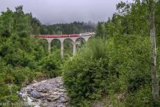 Rhaetian Railway, the Albula and Bernina Lines - Rhaetian Railway in the Albula / Bernina Landscapes: The Glacier Express crossing over the Schmittentobel Viaduct. The Schmittentobel Viaduct... Rhaetian Railway, the Albula and Bernina Lines - Rhaetian Railway in the Albula / Bernina Landscapes: The Glacier Express crossing over the Schmittentobel Viaduct. The Schmittentobel Viaduct...