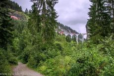 Rhaetian Railway, the Albula and Bernina Lines - Rhaetian Railway in the Albula / Bernina Landscapes: A train passes over the single-track Landwasser Viaduct. The 65-metre-high and 142-metre-long... Rhaetian Railway, the Albula and Bernina Lines - Rhaetian Railway in the Albula / Bernina Landscapes: A train passes over the single-track Landwasser Viaduct. The 65-metre-high and 142-metre-long...