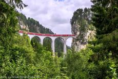 Rhaetian Railway, the Albula and Bernina Lines - Rhaetian Railway in the Albula / Bernina Landscapes: A train on the iconic Landwasser Viaduct outside the Alpine village of Filisur. It seems as... Rhaetian Railway, the Albula and Bernina Lines - Rhaetian Railway in the Albula / Bernina Landscapes: A train on the iconic Landwasser Viaduct outside the Alpine village of Filisur. It seems as...