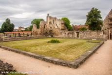 St. Augustine's Abbey in Canterbury - The ruins of the cloister of St. Augustine's Abbey in Canterbury, on the left hand side the roof of the archaeological excavation pit, on...
