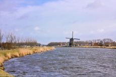 Droogmakerij de Beemster (Beemster Polder) - The Necker windmill on banks of the Beemsterringvaart (Beemster Ring Canal). The Beemster Polder was created in the period 1607-1612, new... Droogmakerij de Beemster (Beemster Polder) - The Necker windmill on banks of the Beemsterringvaart (Beemster Ring Canal). The Beemster Polder was created in the period 1607-1612, new...