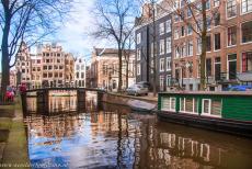 Canal Ring Area of Amsterdam - Canal Ring Area of Amsterdam: A houseboat in one of the canals of Amsterdam. Many people in Amsterdam are living on a houseboat. After... Canal Ring Area of Amsterdam - Canal Ring Area of Amsterdam: A houseboat in one of the canals of Amsterdam. Many people in Amsterdam are living on a houseboat. After...