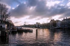Canal Ring Area of Amsterdam - Dark clouds looming over the canals of Amsterdam. Amsterdam is situated inside the imposing Defence Line of Amsterdam, a 135 km long ring of... Canal Ring Area of Amsterdam - Dark clouds looming over the canals of Amsterdam. Amsterdam is situated inside the imposing Defence Line of Amsterdam, a 135 km long ring of...