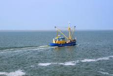 Dutch part of the Wadden Sea - A fishing boat on the Wadden Sea nearby Schiermonnikoog, the smallest of the Dutch inhabited Wadden Islands. The Wadden... Dutch part of the Wadden Sea - A fishing boat on the Wadden Sea nearby Schiermonnikoog, the smallest of the Dutch inhabited Wadden Islands. The Wadden...