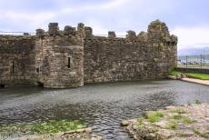 Beaumaris Castle - Castles and Town Walls of King Edward in Gwynedd: The tidal dock of Beaumaris Castle, located near the Gate Next the Sea. The deep moat around the... Beaumaris Castle - Castles and Town Walls of King Edward in Gwynedd: The tidal dock of Beaumaris Castle, located near the Gate Next the Sea. The deep moat around the...