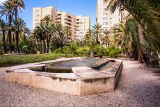 Palmeral of Elche - A cascade fountain in the Palmeral of Elche, the city of Elche in the background. The Palmeral is situated in the heart of... Palmeral of Elche - A cascade fountain in the Palmeral of Elche, the city of Elche in the background. The Palmeral is situated in the heart of...