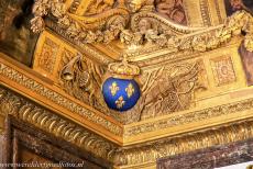 Palace and Park of Versailles - The Palace of Versailles is lavishly decorated, among the decorations is the coat of arms of the Kingdom of France (Moderne): the three... Palace and Park of Versailles - The Palace of Versailles is lavishly decorated, among the decorations is the coat of arms of the Kingdom of France (Moderne): the three...