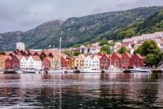 Bryggen - The iconic waterfront of Bergen, the houses of the quayside Bryggen reflected in the waters of the fjord. Bryggen is the historic... Bryggen - The iconic waterfront of Bergen, the houses of the quayside Bryggen reflected in the waters of the fjord. Bryggen is the historic...