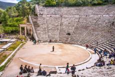 Sanctuary of Asklepios at Epidaurus - Sanctuary of Asklepios at Epidaurus: The circular stage of the Theatre at Epidaurus and the marble entrance gate on the western side... Sanctuary of Asklepios at Epidaurus - Sanctuary of Asklepios at Epidaurus: The circular stage of the Theatre at Epidaurus and the marble entrance gate on the western side...