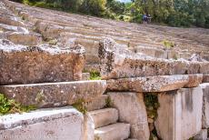 Sanctuary of Asklepios at Epidaurus - The limestone seats of the Theatre at the Sanctuary of Asklepios at Epidaurus. The sanctuary is renowned for its ancient... Sanctuary of Asklepios at Epidaurus - The limestone seats of the Theatre at the Sanctuary of Asklepios at Epidaurus. The sanctuary is renowned for its ancient...