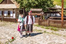 Old Village of Hollókő - The Old Village of Hollókő and its Surroundings: A couple dressed in traditional Palóc costume. The tiny village... Old Village of Hollókő - The Old Village of Hollókő and its Surroundings: A couple dressed in traditional Palóc costume. The tiny village...