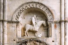 Saint Hilaire Church in Melle - Saint Hilaire Church in Melle: The sculpture above the north entrance portal depicts a crowned horseman whose horse tramples a half... Saint Hilaire Church in Melle - Saint Hilaire Church in Melle: The sculpture above the north entrance portal depicts a crowned horseman whose horse tramples a half...
