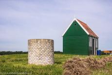 Schokland and Surroundings - Schokland and Surroundings: A water well next to a tiny wooden family house in Middelbuurt, a former fishing village. In the prehistoric... Schokland and Surroundings - Schokland and Surroundings: A water well next to a tiny wooden family house in Middelbuurt, a former fishing village. In the prehistoric...